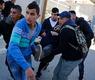 شباب فلسطينيون ينقلون جريحا أصيب بمواجهات مع القوات الإسرائيلية